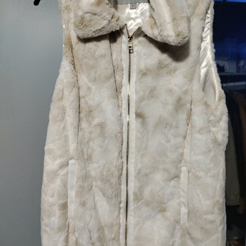 Ladies off white vest.